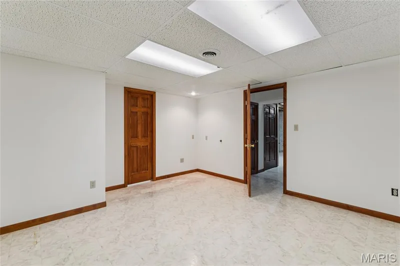 A finished office space downstairs offers a quiet spot to work or study, with a walk-in closet just off to the side and a half bath conveniently steps away. — 416 Loiselaine Drive, O'Fallon, MO 63366