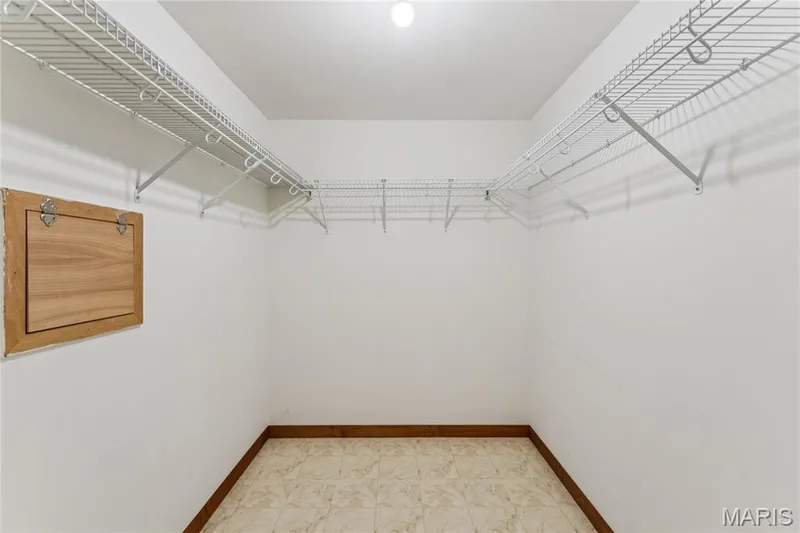 Wall-to-wall shelving gives this walk-in closet serious storage capacity, room to organize everything without the clutter. — 416 Loiselaine Drive, O'Fallon, MO 63366