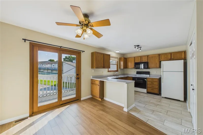 Spacious kitchen and dining area — 3405 Sherman Park Drive #4C, St Charles, MO 63303