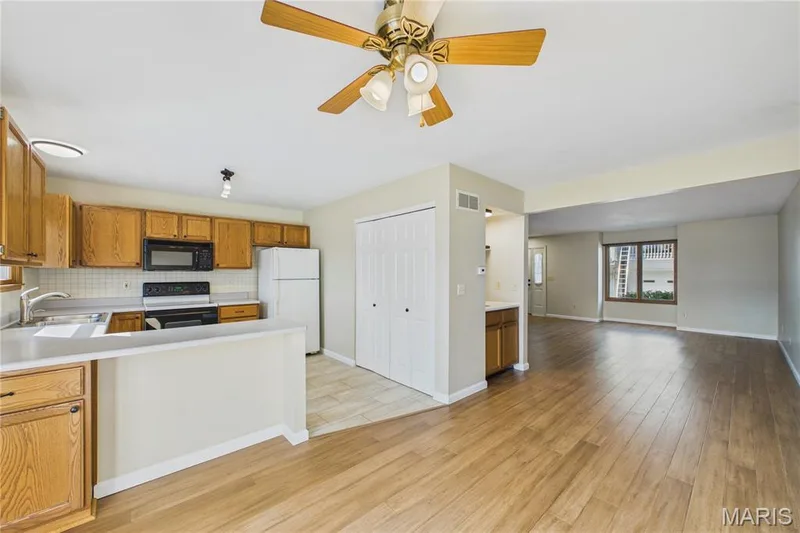 Dining area just off the kitchen looking at the main living space. — 3405 Sherman Park Drive #4C, St Charles, MO 63303