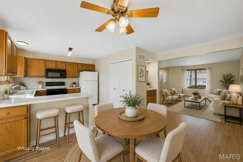 Dining area just off the kitchen looking at the main living space. — 3405 Sherman Park Drive #4C, St Charles, MO 63303