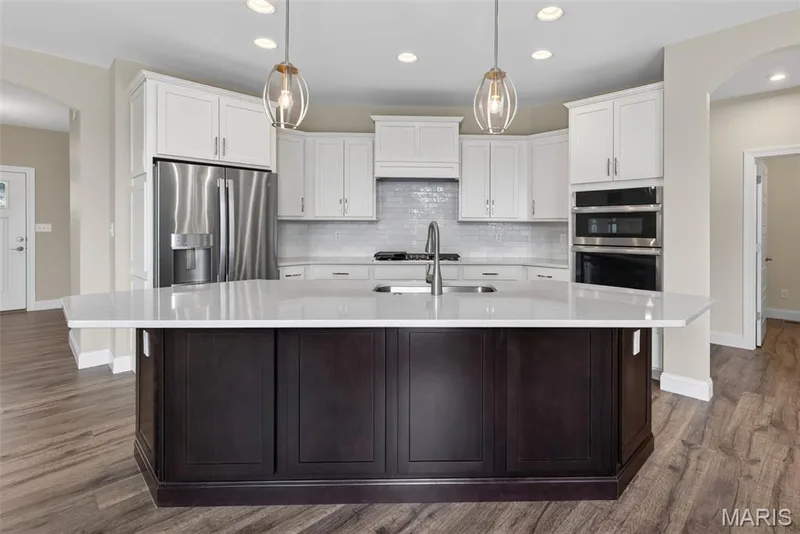 Large Center Island, Seating Bar, Quartz Countertops, Stainless Steel Appliances and Gas Cooktop — 149 Haven Ridge Court, Dardenne Prairie, MO 63368