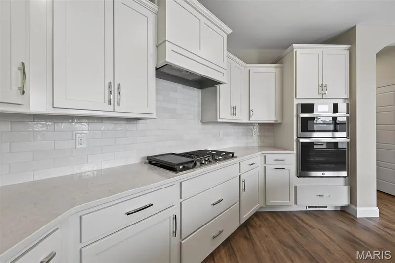 Gas Cooktop, Range Hood, Wall Ovens and Tile Backsplash — 149 Haven Ridge Court, Dardenne Prairie, MO 63368