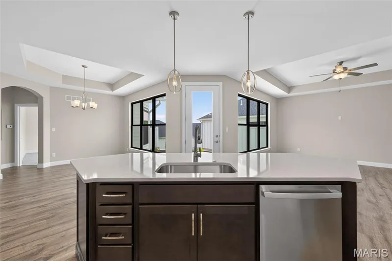 Island with Large Sink, Quartz Countertops and Seating Bar — 149 Haven Ridge Court, Dardenne Prairie, MO 63368