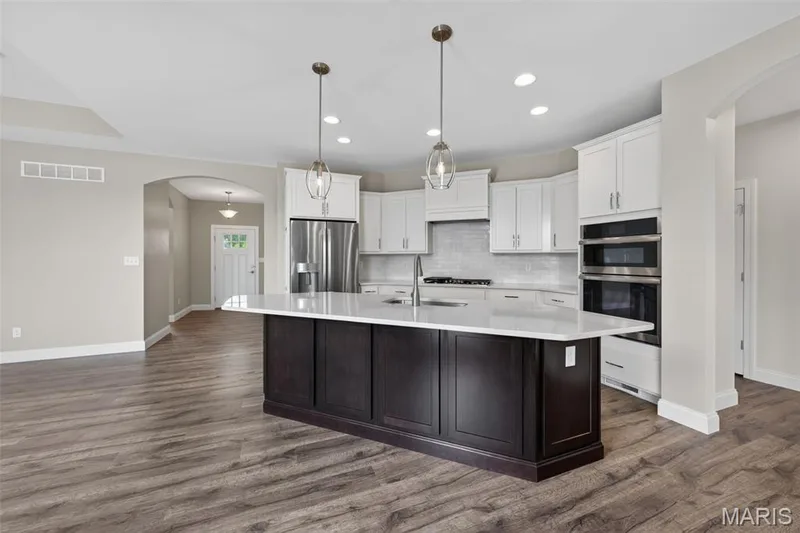 Kitchen with Large Island and Seating Bar — 149 Haven Ridge Court, Dardenne Prairie, MO 63368