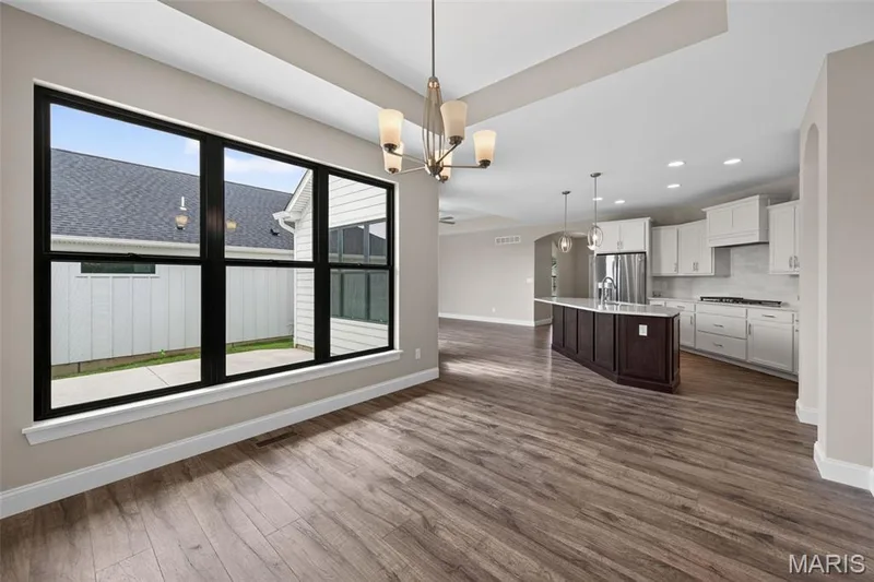 Dining Room with Tray Ceiling and Luxury Vinyl Plank Flooring — 149 Haven Ridge Court, Dardenne Prairie, MO 63368