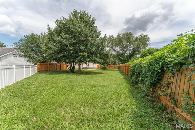 Expansive grassy yard with mature trees — 1721 Summergate Court, St Charles, MO 63303