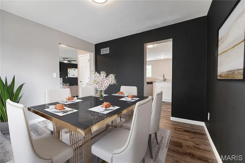 Wood-finish flooring throughout, featuring a recessed ceiling light and white trim — 1721 Summergate Court, St Charles, MO 63303