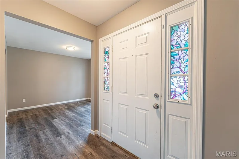 Entry door with decorative stained glass sidelights — 1721 Summergate Court, St Charles, MO 63303
