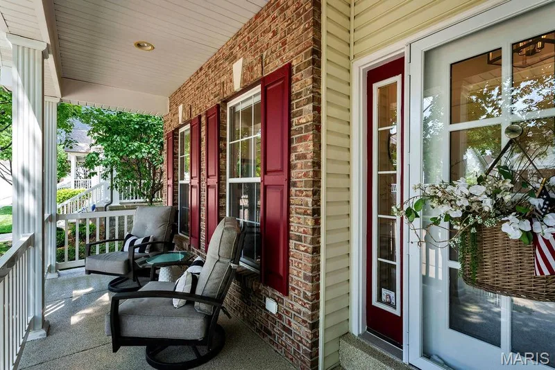 Covered front porch is the perfect spot to catch up with neighbors or relax with a friend. — 781 Queens Court Place, St Peters, MO 63376