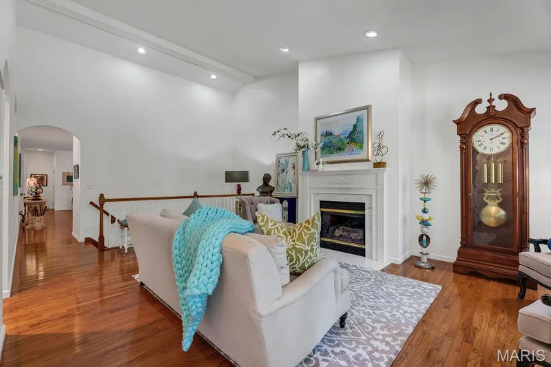 Gracious great room has a soaring vaulted ceiling with can lighting. — 781 Queens Court Place, St Peters, MO 63376
