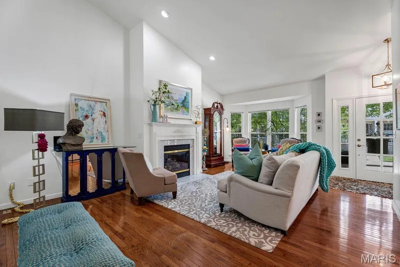 Check out the gleaming wood floors! They flow through the majority of the main living areas. — 781 Queens Court Place, St Peters, MO 63376
