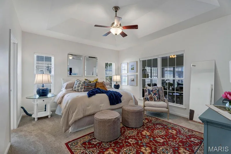 If you like lots of natural light, this room has 2 windows that flank the bed and windows that look into the sunroom! — 781 Queens Court Place, St Peters, MO 63376