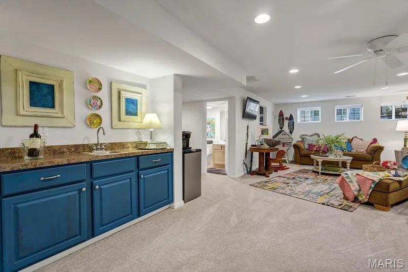 Besides a Heatilator fireplace to add warmth and ambiance, you also get a wet bar space. Perfect for cocktails, coffee or snacks. — 781 Queens Court Place, St Peters, MO 63376
