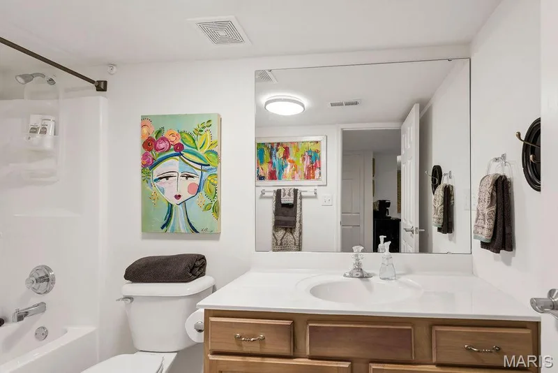 3rd full bath in the finished lower level offers a tub/shower surround. — 781 Queens Court Place, St Peters, MO 63376