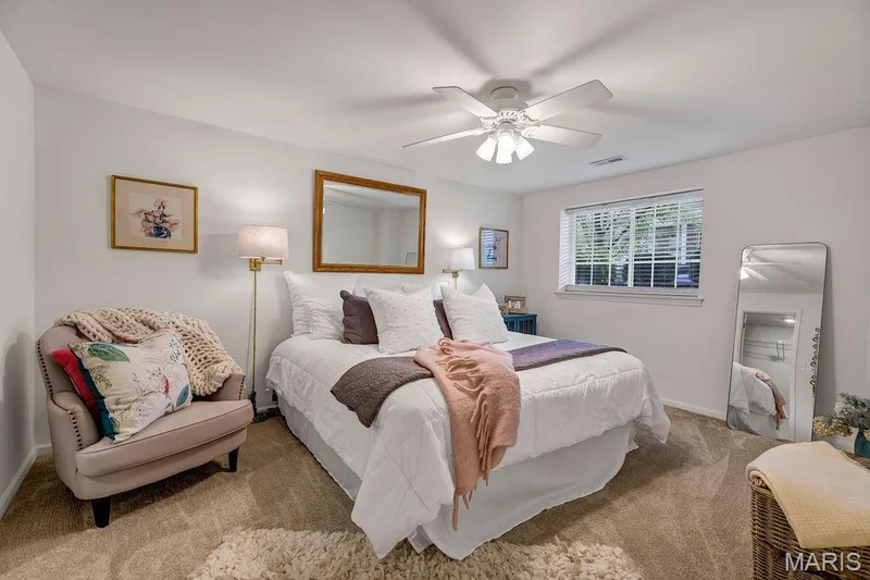 3rd Bedroom in the basement is perfect for guests. It has a large egress window for natural light. — 781 Queens Court Place, St Peters, MO 63376