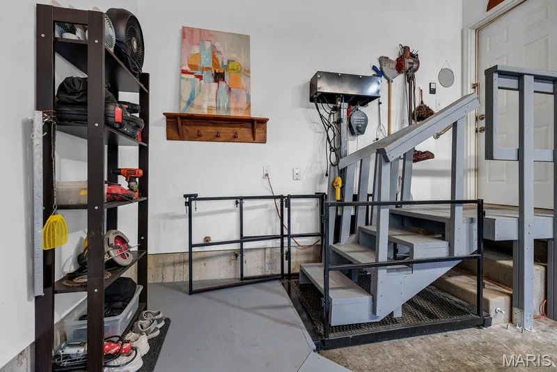 The seller is leaving this chair lift for those with a need or wishing to avoid steps. There is also a water spigot hidden behind the railing, making it convenient when watering plants, washing cars or cleaning out the garage. — 781 Queens Court Place, St Peters, MO 63376