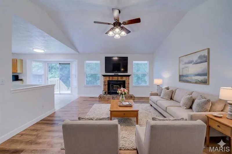 Virtually Staged - Vaulted Great Room with Wood Burning Fire Place and Ceiling Fan — 868 Molloy Drive, O'Fallon, MO 63366