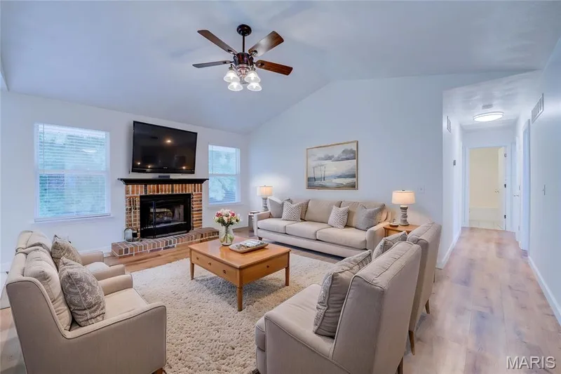 Virtually Staged - Vaulted Great Room with Wood Burning Fire Place and Ceiling Fan — 868 Molloy Drive, O'Fallon, MO 63366