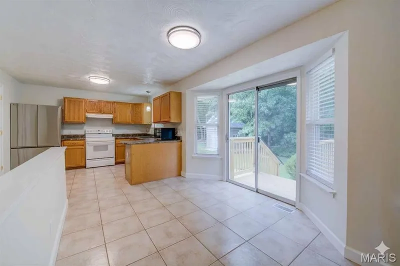 Breakfast Room with Bay Window and Sliding Glass Door to Back Patio — 868 Molloy Drive, O'Fallon, MO 63366
