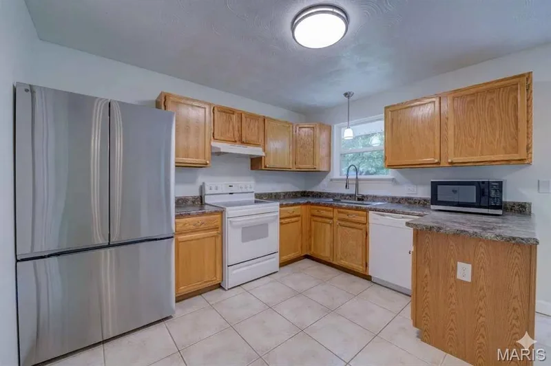 Kitchen with New LG French Door Refrigerator (included) — 868 Molloy Drive, O'Fallon, MO 63366