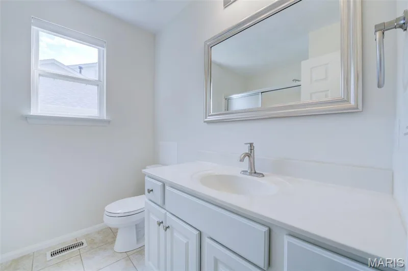 Primary Bedroom with New Vanity, Faucet and Lighting — 868 Molloy Drive, O'Fallon, MO 63366