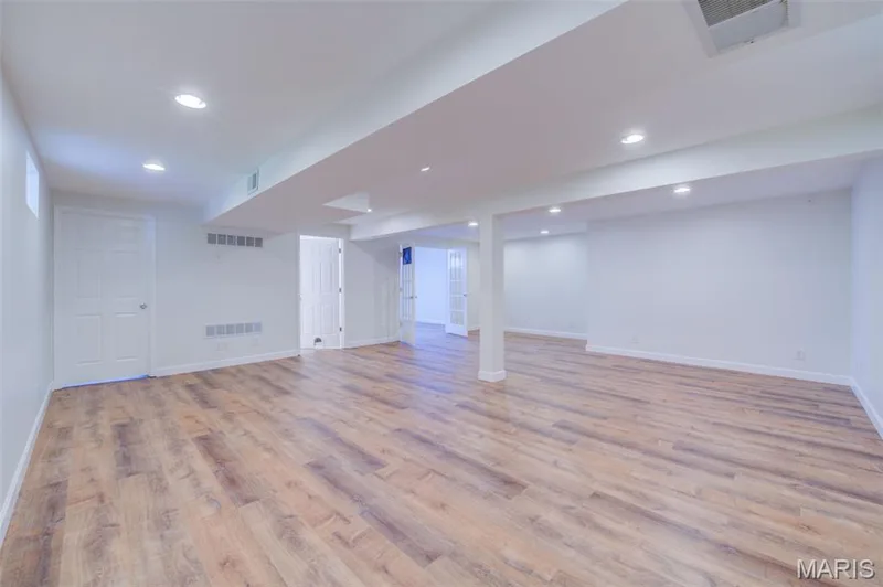 Lower Level Rec / Family Room with 1/2 Bath and Home Office / Flexible Sleeping Space with Glass French Doors — 868 Molloy Drive, O'Fallon, MO 63366