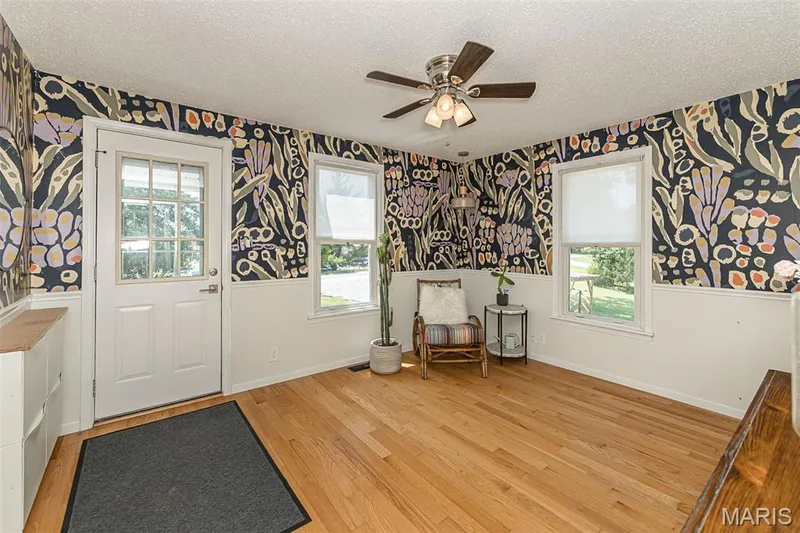 Chair rail and bright room with windows — 17723 Mueller Road, Wildwood, MO 63038