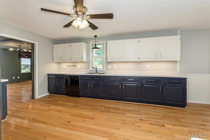 Hardwood floor, under cabinet lighting, rocker switches in the kitchen — 17723 Mueller Road, Wildwood, MO 63038