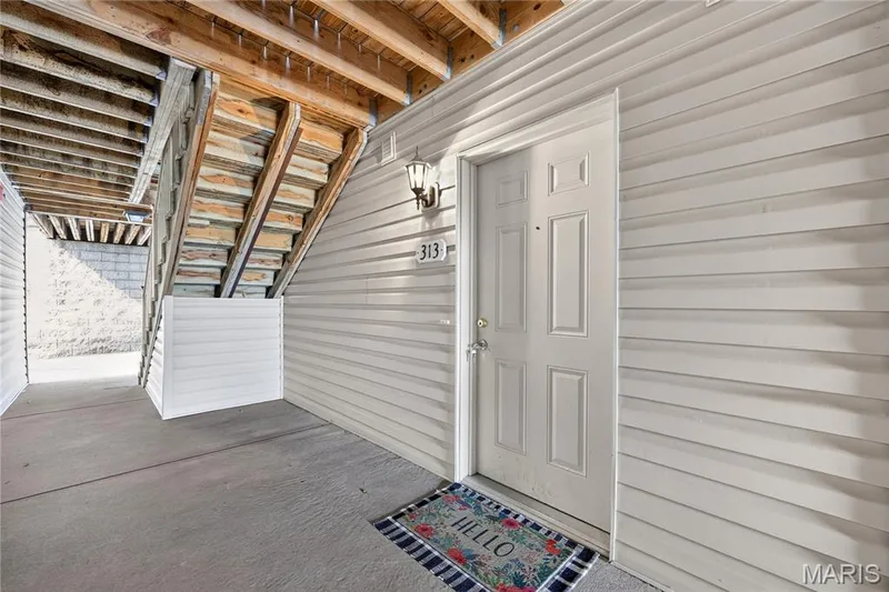 Panel exterior with a paneled entry door — 313 Bramblett Hills, O'Fallon, MO 63366