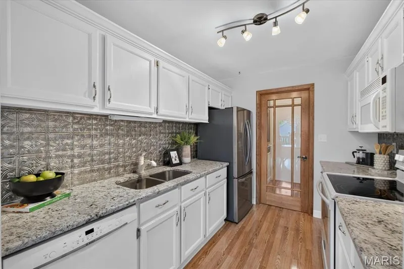 Designer Door leads into Laundry Room included Washer & Dryer — 16252 Lea Oak Court, Chesterfield, MO 63017