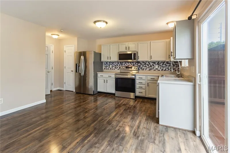 Pantry located next to refrigerator — 114 Waterside Crossing Drive, St Peters, MO 63376