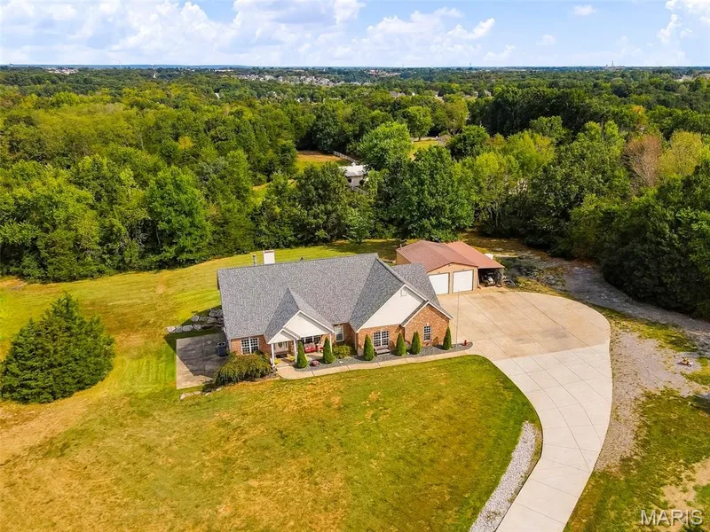 Nestled on a private drive with nature all around — 1 Priority Drive N, Wentzville, MO 63385