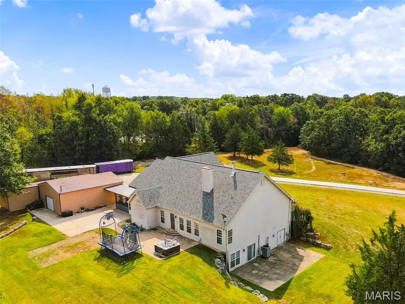 Walkout lower level opens to side patio — 1 Priority Drive N, Wentzville, MO 63385