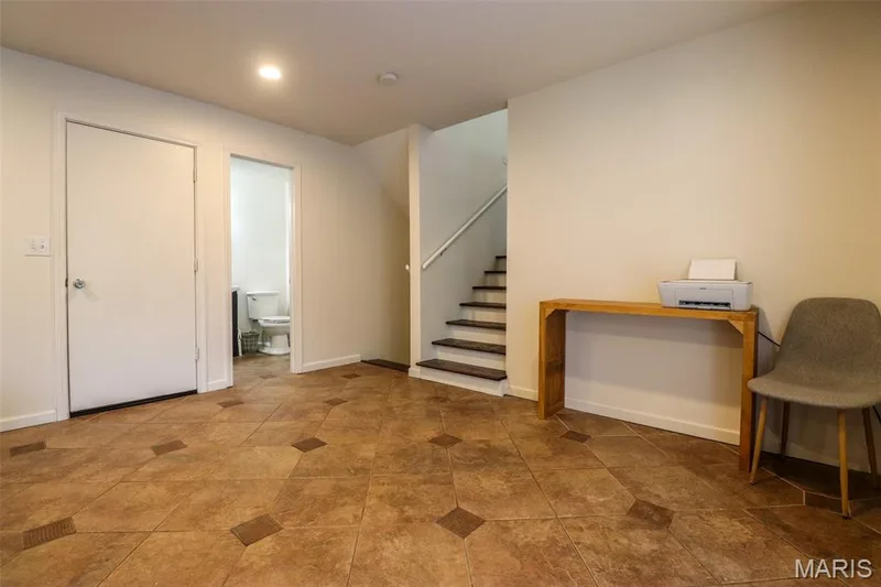 Door to the garage and a half bathroom — 12 Pyrenees Drive, Lake St. Louis, MO 63367