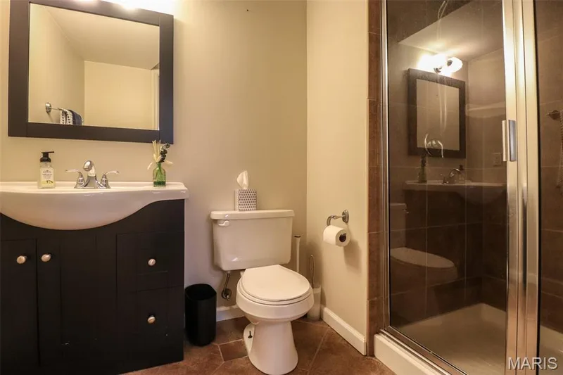 Full bathroom in lower level with walk in tile shower and tile floors — 12 Pyrenees Drive, Lake St. Louis, MO 63367