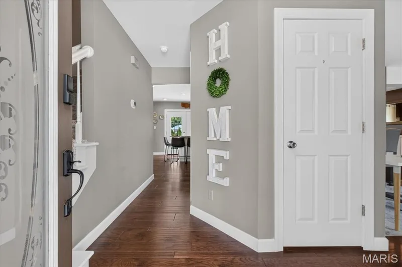 Welcoming Entry -Beautiful Wood Floors extend throughout the main level — 303 Whispering Woods Drive, St Peters, MO 63304
