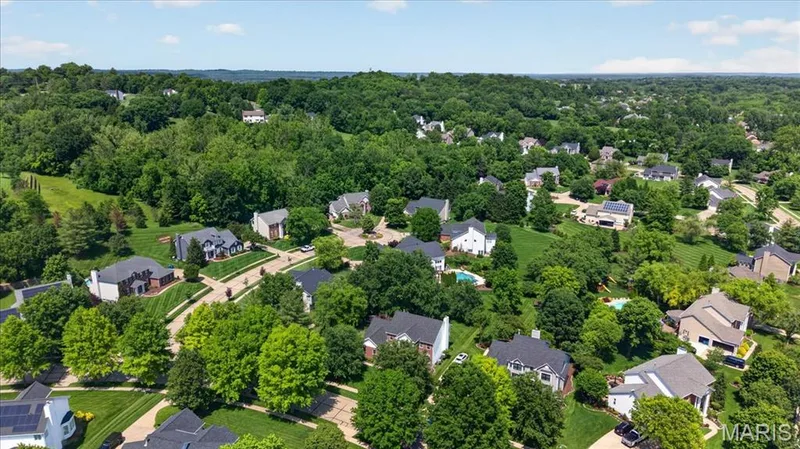 Expansive residential area featuring numerous properties set among abundant mature trees and verdant landscapes — 17821 Wilderness Cliff Court, Wildwood, MO 63005