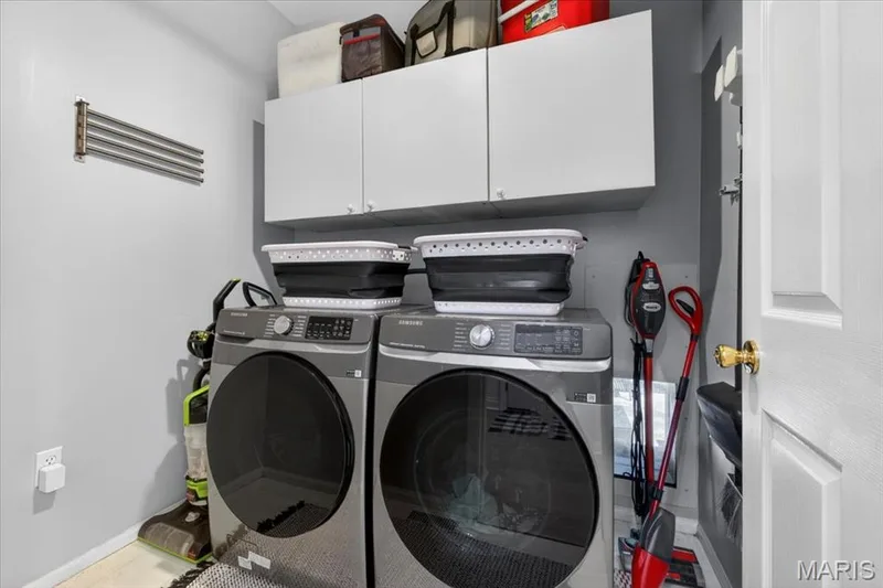 Built-in white cabinetry provides storage — 17821 Wilderness Cliff Court, Wildwood, MO 63005