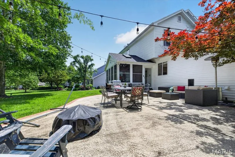 Expansive concrete patio offering multiple seating areas — 17821 Wilderness Cliff Court, Wildwood, MO 63005
