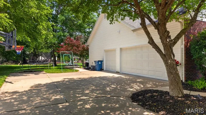 Concrete driveway offering ample parking — 17821 Wilderness Cliff Court, Wildwood, MO 63005