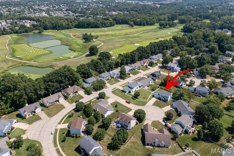 Residential neighborhood with cul-de-sac street patterns and mature tree landscaping, bordering a golf course with multiple water features — 120 Bromley Court, O'Fallon, MO 63368