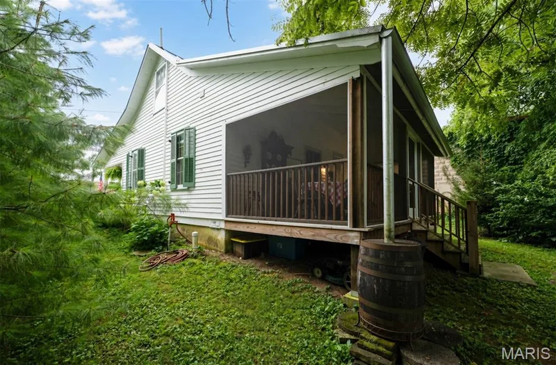 Rain barrel and screen porch at rear of home. — 215 Jackson Street, Augusta, MO 63332