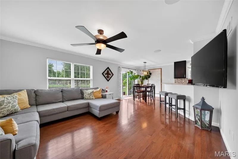 Gleaming hardwood floors & natural light show off this open concept Living Room! — 3120 Bentwater Place, St Charles, MO 63301
