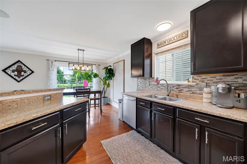 Gorgeous backsplash & custom cabinets with matching finishes! — 3120 Bentwater Place, St Charles, MO 63301