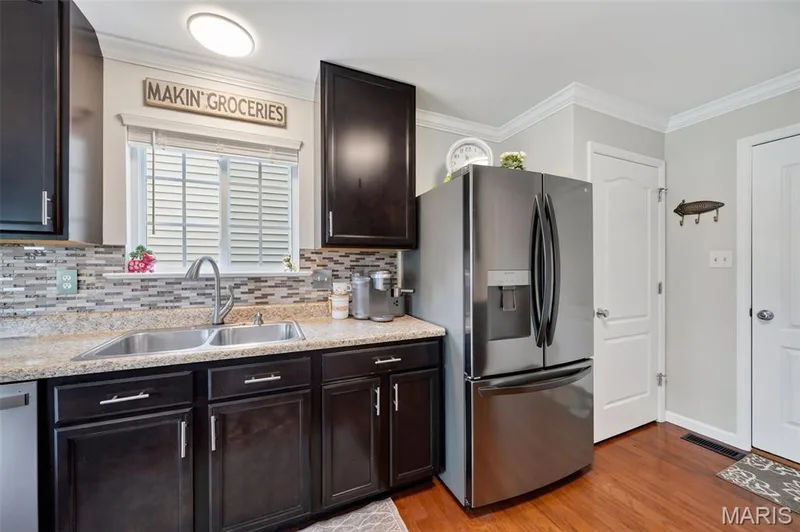 Gorgeous backsplash & custom cabinets with matching finishes! — 3120 Bentwater Place, St Charles, MO 63301