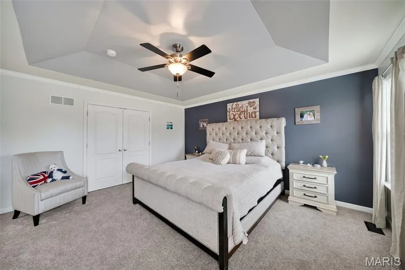 Primary bedroom is large with lots of natural light, stunning coffered ceiling & double door walk-in closet with closet system! — 3120 Bentwater Place, St Charles, MO 63301