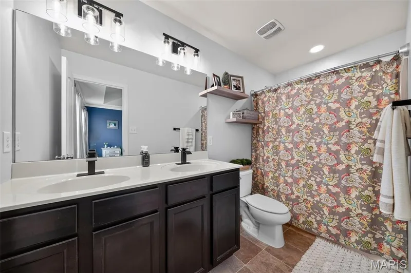 Adult height vanity with double sinks & newly installed faucets & lighting fixtures! — 3120 Bentwater Place, St Charles, MO 63301