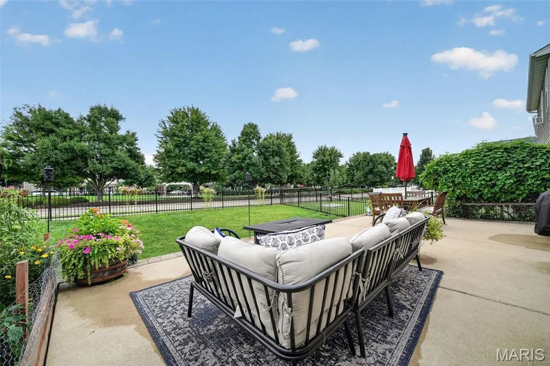 Massive patio for outdoor entertaining & summer BBQ's! & look right across the street! There's a playground & pavilion for even more fun! — 3120 Bentwater Place, St Charles, MO 63301