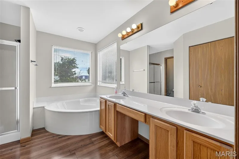 Double Sinks with knee-hole space & large corner tub — 2714 Red Cedar Parc Drive S, O'Fallon, MO 63368